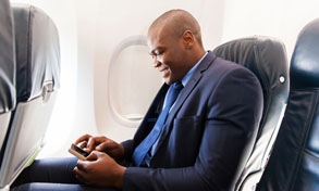 man on plane with mobile device, Xerox, Connect Key, LSI, Logistical Support, Inc., Xerox, HP, Oregon, Copier, Printer, MFP, Sales, Service, Supplies